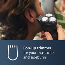 Cordless electric shaver with pop-up trimmer near jawline, black