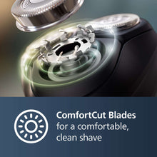 Electric shaver head with rotating cutting blades and metal foil ring