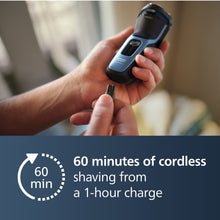 Electric shaver charging with USB plug held near the power module