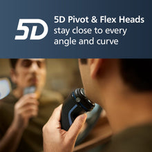 Electric shaver held in hand with rounded shaving head for close-angle trimming