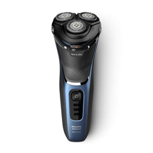 Electric shaver with three round heads, power button, and blue grip panel