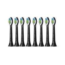 8-pack replacement toothbrush heads in black with blue and green bristle tips.