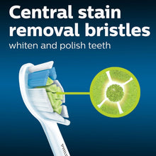 Toothbrush head with blue bristles and central green bristle insert
