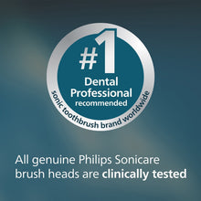 Philips Sonicare replacement brush head with purple bristles on a white handle
