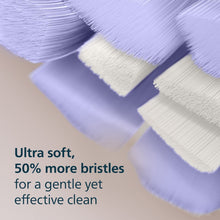 Close-up of extra-soft bristles on a replacement brush head with purple bristle tips