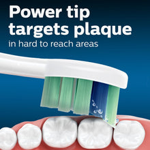 Sonicare power-tip brush head with angled bristle rows
