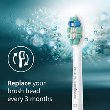 Philips Sonicare replacement brush head with soft green bristles and blue accents, bubbles