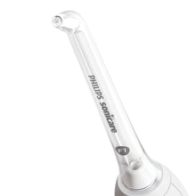 White oral irrigator handle with nozzle tip and setting marked F1