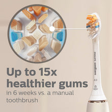 Toothbrush head on white handle with blue bristles and orange tips, A3