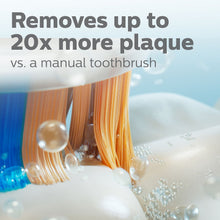 Close-up of rotating toothbrush bristles with blue and orange tips