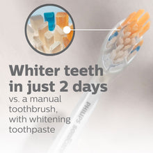 White Philips Sonicare replacement toothbrush head with blue and orange gel on bristles