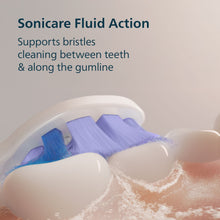 Sonicare brush head cleaning between teeth and along the gumline