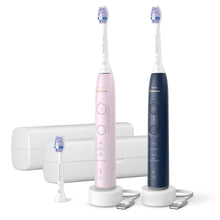 Rechargeable Sonicare toothbrush set in pink and blue with brush heads and charging dock