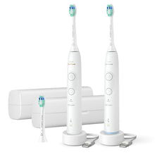 Rechargeable toothbrush set with white handles and blue-green brush heads, two-pack