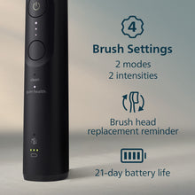 Black electric toothbrush handle with brush settings indicators and status lights