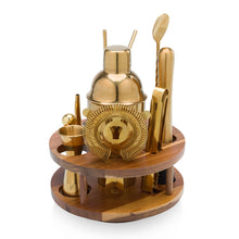 Acacia bar tool set on round tray with gold-toned shakers and tools