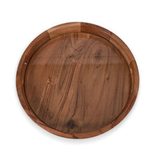 Round acacia wood serving tray, underside view with carved wood grain pattern