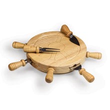 Wooden lazy Susan with wheel and nautical cutouts, four turned handles