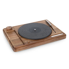 Acacia wood turntable cheese board with dark slate-style center and serving knife.