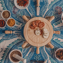 Round wooden lazy Susan wheel with radial spokes and center hub