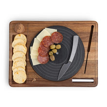 Turntable cheese board with dark slate insert, assorted cheeses, and side knife.