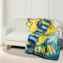 Character throw blanket on couch with Pikachu plush hugger and “ENJOY” text