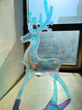Iridescent reindeer balloon decoration by window, full body standing