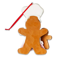 Back view gingerbread chef ornament with white hat, brown body and red hanging string