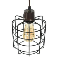 Caged glass bulb with black wire guard on dark socket atop pole.