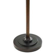 Floor lamp base with round dark metal pedestal and central stem.