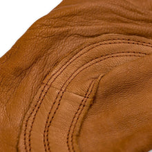 Brown leather glove palm with stitched seams and reinforced finger panels