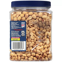 Dry roasted peanuts jar with ingredients label on blue panel and peanuts inside.