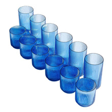 Blue ribbed plastic drink cups, staggered row of assorted heights