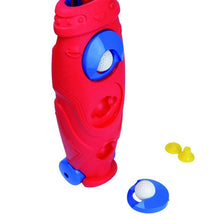 Red golf caddy toy with side ball opening and blue base, plus white golf ball
