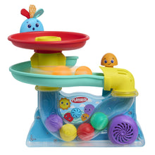 Busy ball popper toy with red disc top, teal tray, yellow side launcher, purple speaker.