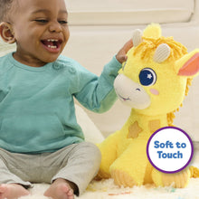 Yellow giraffe plush stuffed animal held by child, with blue star eyes and soft fur