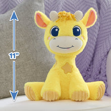 Yellow giraffe plush with blue star eyes and heart charm, shown seated on fabric