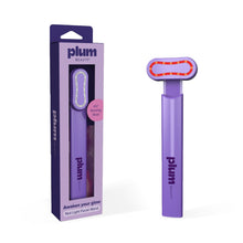 Plum red light facial wand with rotating light bar head beside retail box