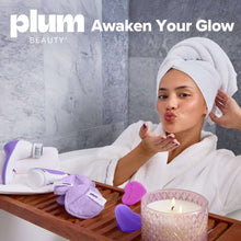 Purple red light facial wand on tray near woman with towel