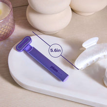 Purple facial wand with 5.6in label and red light panel head