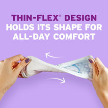 Ultra-thin incontinence pad held and flexed by hands for all-day comfort