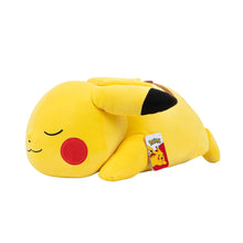 Sleeping Pikachu plush with hanging fabric tag, yellow stuffed toy with red cheek patches