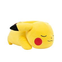 Sleeping Pikachu plush lying on side, yellow fabric with red cheek circle and closed eyes
