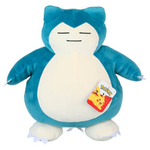 Sleeping Snorlax plush toy with hang tag on white belly, teal fur and closed eyes