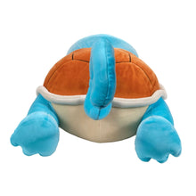 Sleeping Squirtle plush from back view, orange shell with blue tail and feet
