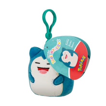 Snorlax clip-on plush keychain, teal, face front with round product tag, green loop