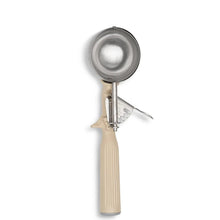 Stainless steel portion scoop with beige thumb press handle, 3.25 oz capacity