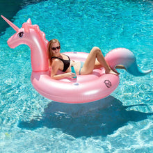 Pink unicorn inflatable pool float with handles and horn