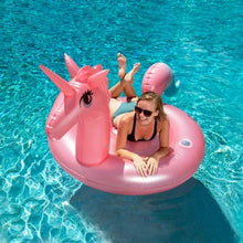 Pink unicorn inflatable pool float with rider and raised horn