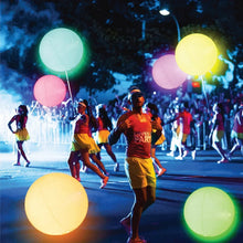 Light-up pool beach game balls, pastel glowing round LED spheres in a multi-ball set